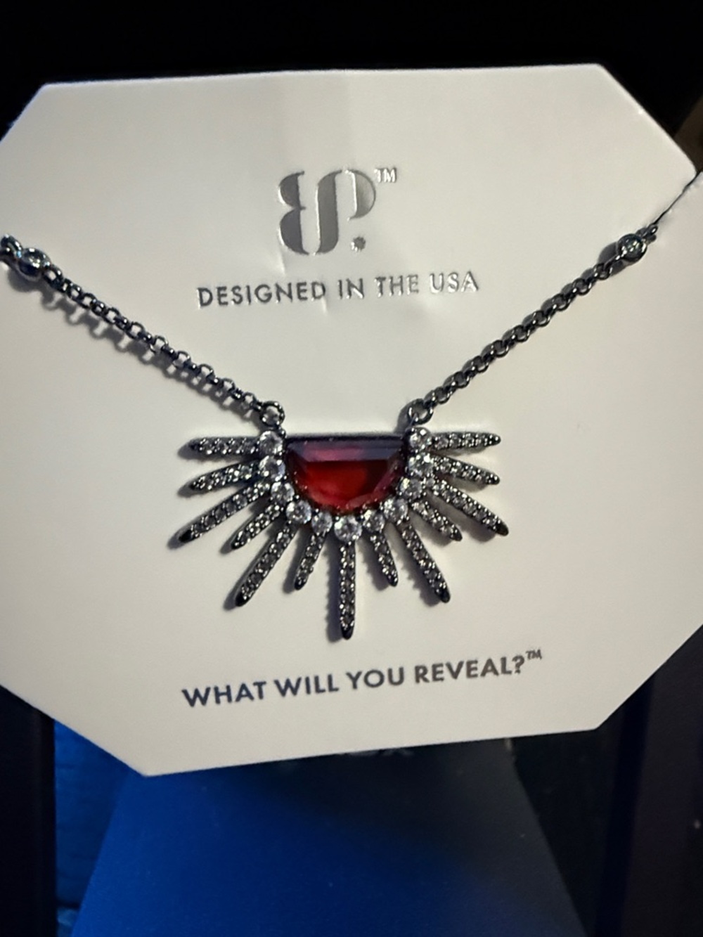 BP garnet CZ Sunburst design with clear CZ accents.